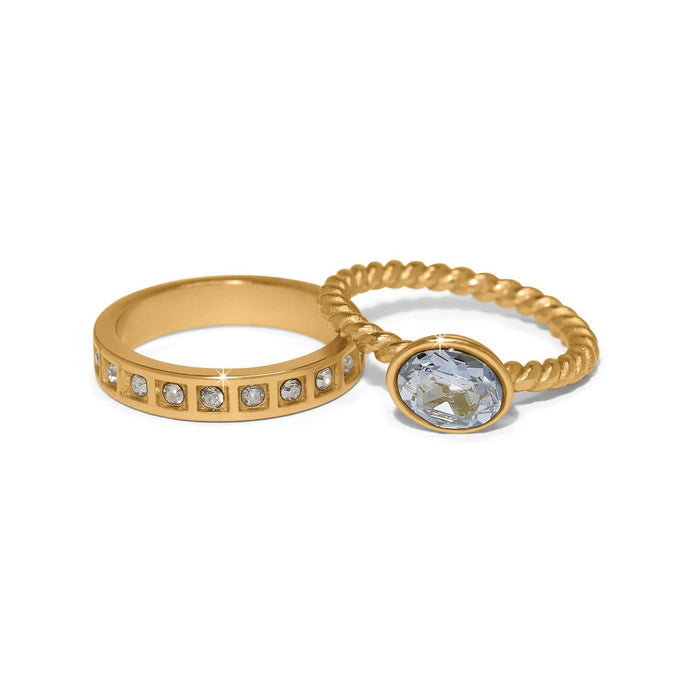 Brighton gold-plated ring set with crystal-lined band and twisted rope band featuring oval crystal on a white background