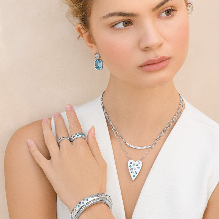 Model wearing a Brighton silver-plated heart pendant necklace with crystal accents and coordinating Brighton accessories