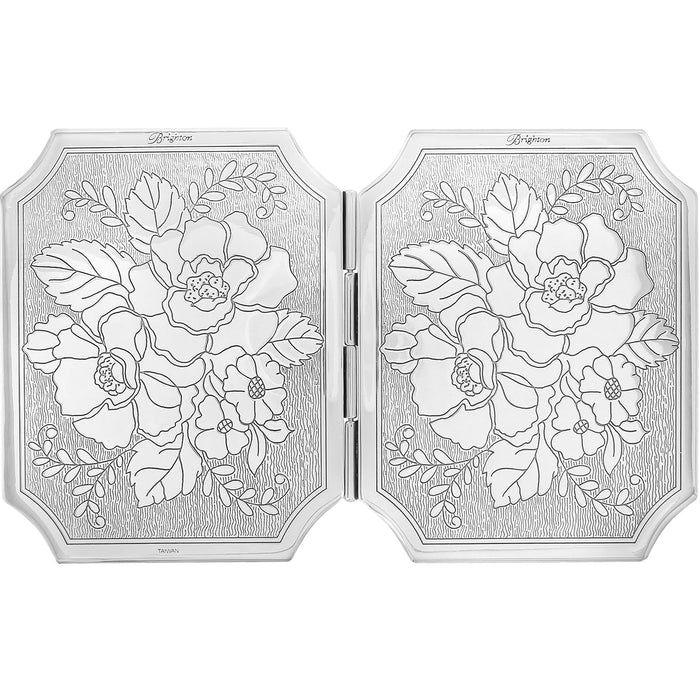 Brighton compact mirror shown open with silver-plated floral engraved design on both hinged panels on a white background