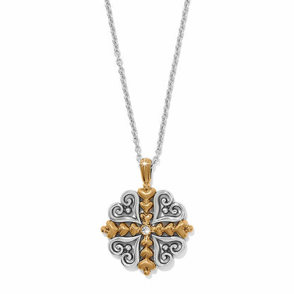 Brighton pendant necklace with two-tone scrollwork cross design and center crystal accent on a white background