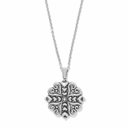 Brighton pendant necklace with ornate silver-tone medallion featuring scrollwork and heart motifs on a white background