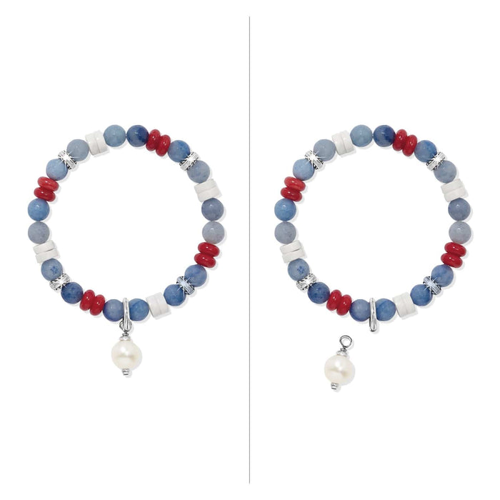 Brighton beaded bracelet with blue, red, and white beads, silver-plated accents, and pearl charm on a white background