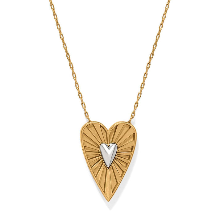 Brighton heart pendant necklace with gold-plated radiating sunburst design and silver-tone heart center on a white background
