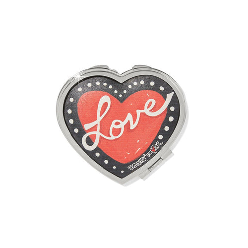 Brighton heart-shaped compact mirror with red heart and white Love script on black background on a white background