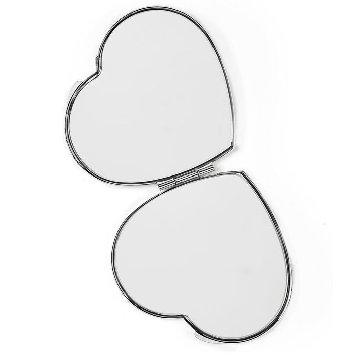 Brighton heart-shaped compact mirror shown open with silver-tone metal frame and dual mirrored surfaces on a white background