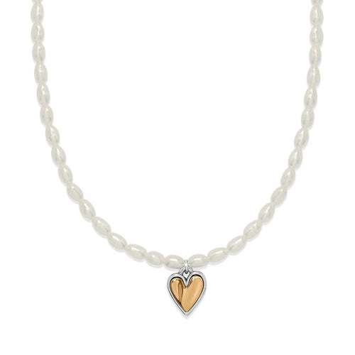 Brighton pearl necklace with rice pearls and two-tone heart pendant in silver and gold on a white background
