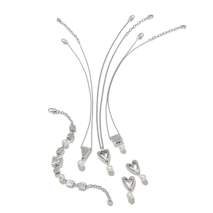 Brighton silver-plated jewelry set styled with barque pearl accents and heart and square motifs on a white background