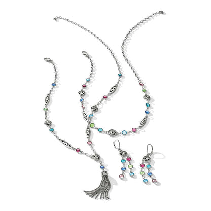 Brighton silver-plated jewelry set with multicolored crystals, scroll-detail links, tassel pendant necklace, and matching earrings on a white background