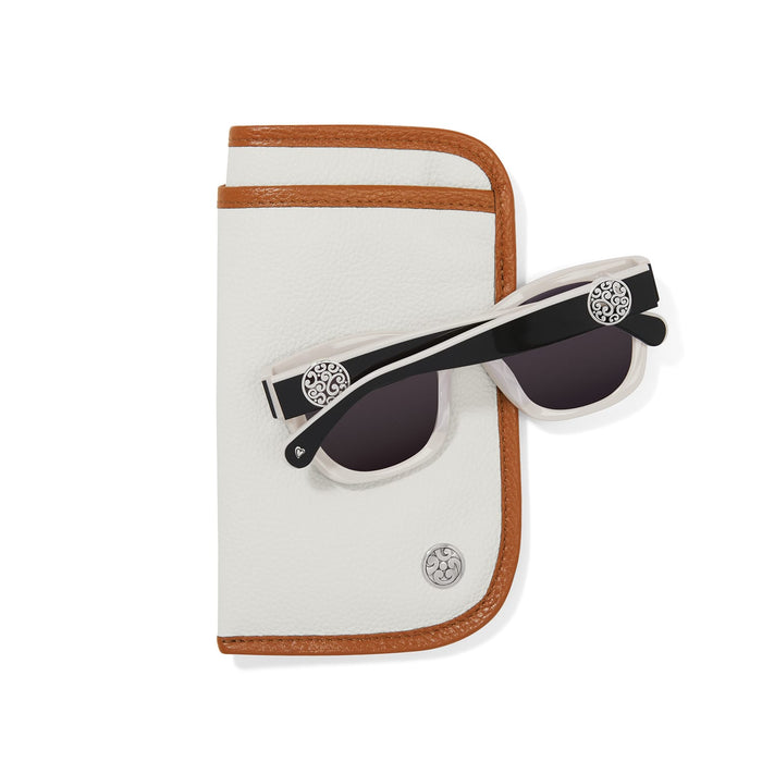 Brighton white and tan leather eyeglass case styled with black and white sunglasses featuring silver-plated medallion accents