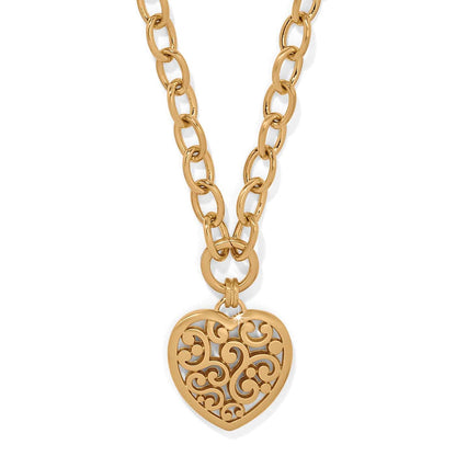 Brighton heart pendant necklace with gold-plated filigree scrollwork design on a chunky oval link chain on a white background