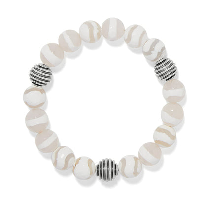Brighton beaded bracelet with cream and white striped stones and silver-plated ribbed accent beads on a white background