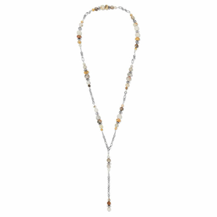 Brighton lariat necklace with cream and tan stone beads and silver-plated chain links on a white background