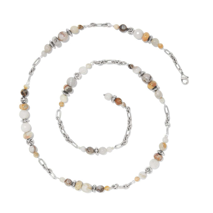 Brighton beaded necklace with cream and tan stones, silver-plated chain links, and decorative accent beads on a white background