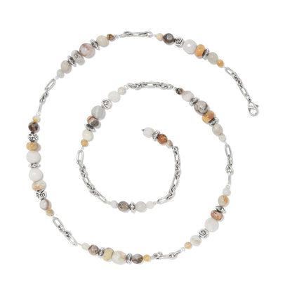 Brighton beaded necklace with cream and tan stones, silver-plated chain links, and decorative accent beads on a white background