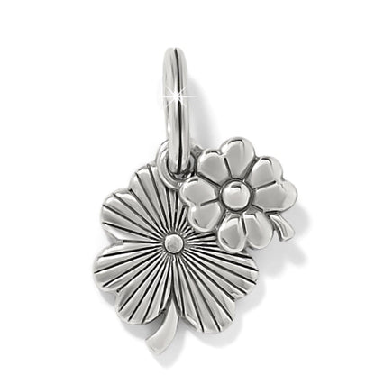 Brighton charm with silver-plated four-leaf clover and flower design featuring textured and polished details on a white background