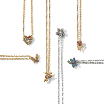 Brighton necklaces styled with crystal heart, butterfly, hummingbird, flower, and tulip pendants in gold-tone and silver-plated finishes