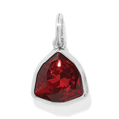 Brighton charm with faceted red crystal in silver-plated triangular bezel setting and jump ring on a white background