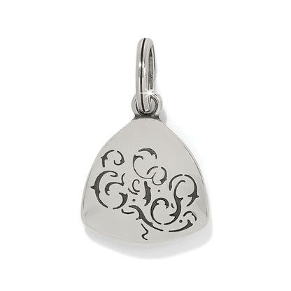 Brighton silver-plated charm with rounded triangular shape and engraved black scrollwork design on a white background