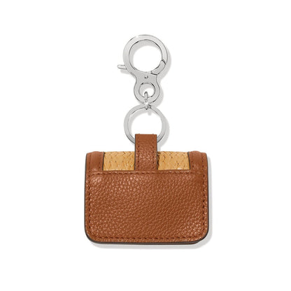 Brighton bag charm shown from the back in brown leather and faux straw with silver-tone clasp on a white background