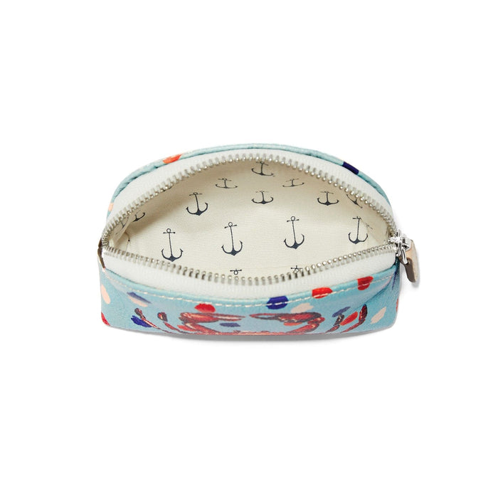Brighton coin pouch shown open with light blue crab print exterior and anchor print interior on a white background