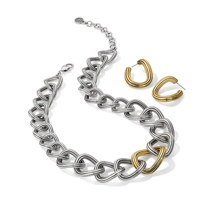 Brighton silver-plated chunky chain link necklace with gold-plated accent link, styled with gold-plated hoop earrings on white