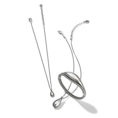 Brighton silver-plated necklace and bangle bracelet set with hammered teardrop pendant and textured oval bangle on a white background