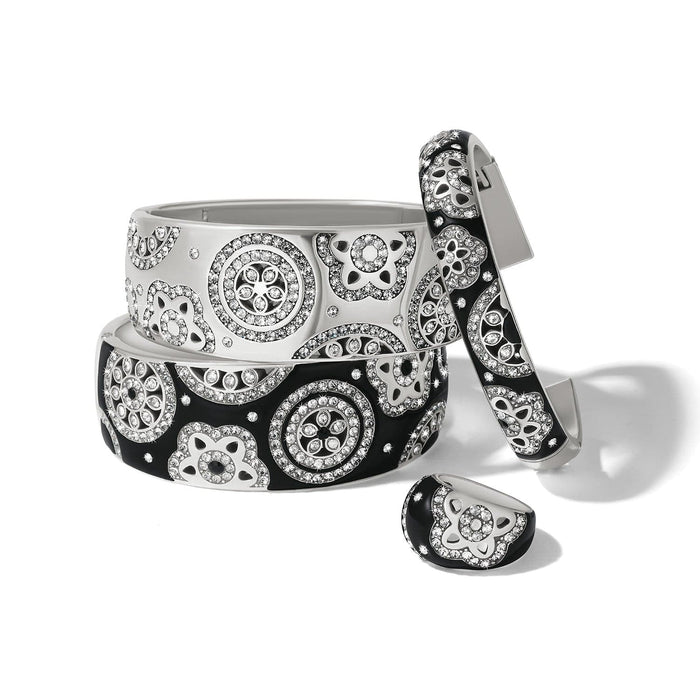Brighton silver-plated bangles and ring with black and white enamel and crystal floral medallions on a white background