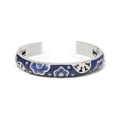 Brighton cuff bracelet with blue enamel floral design, crystal accents, and silver-plated finish on a white background