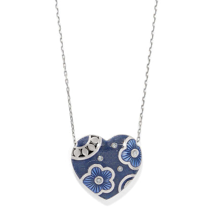 Brighton heart pendant necklace with blue enamel floral design, crystal accents, and silver-plated chain on a white background