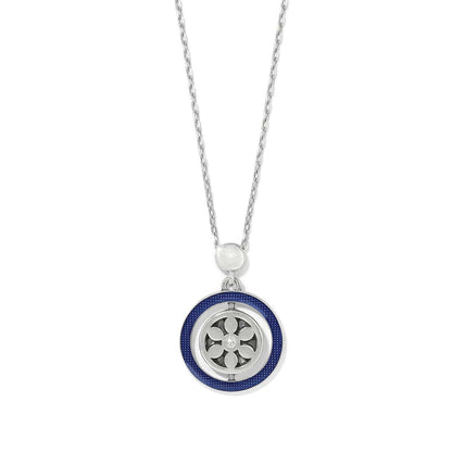 Brighton pendant necklace with silver-plated medallion, blue enamel ring, and crystal accents on a white background