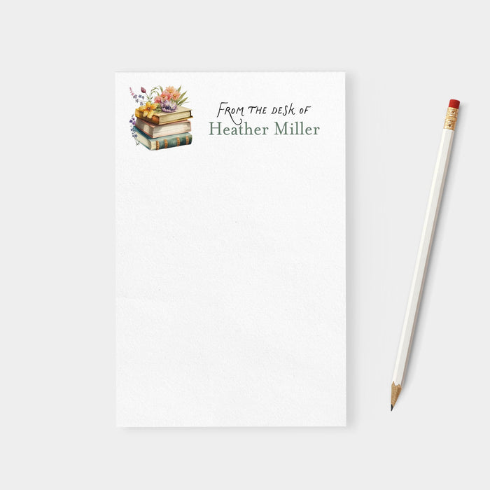 Notebook with 'From the desk of Heather Miller' text and a pencil on a white background