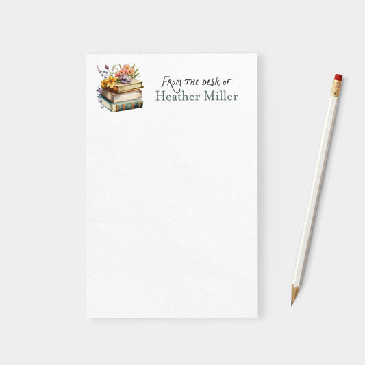Notebook with 'From the desk of Heather Miller' text and a pencil on a white background