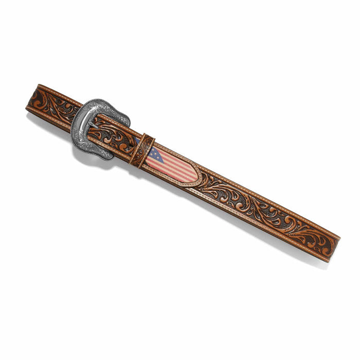 Brighton leather belt with tooled scrollwork, American flag inlay, and engraved silver-tone buckle on a white background