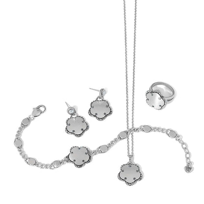 Brighton silver-plated jewelry set with floral pendant necklace, earrings, ring, and bracelet featuring crystals on a white background