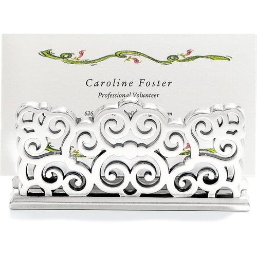 Brighton business card holder with silver-plated ornate scrollwork design holding a printed card on a white background