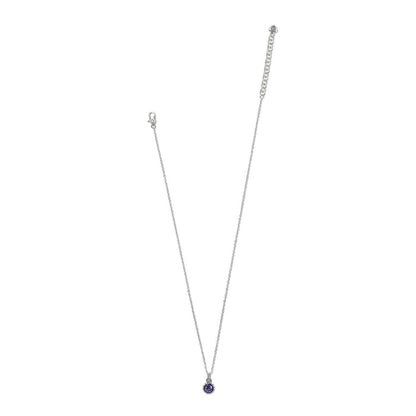 Brighton silver-plated pendant necklace with round purple crystal drop and lobster clasp on a white background