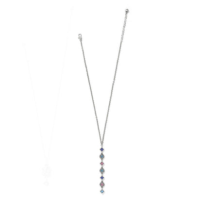 Brighton silver-plated drop necklace with vertical line of blue, pink, and aqua crystals on a white background