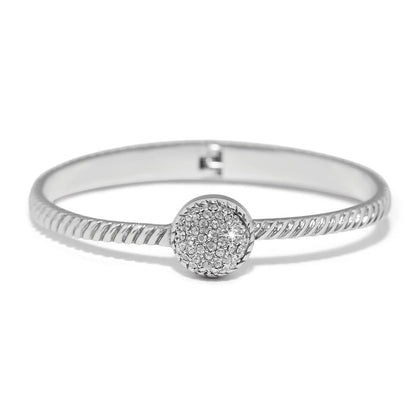 Brighton bangle bracelet with twisted silver-plated band and round crystal pavé centerpiece on a white background