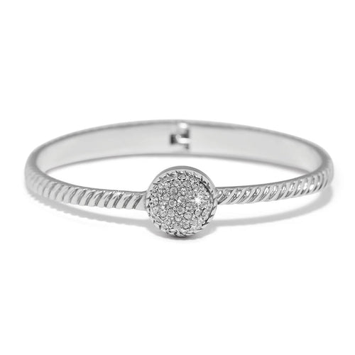 Brighton bangle bracelet with twisted silver-plated band and round crystal pavé centerpiece on a white background
