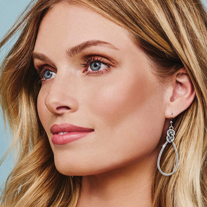 Close up of model wearing Interlok French Wire Earrings