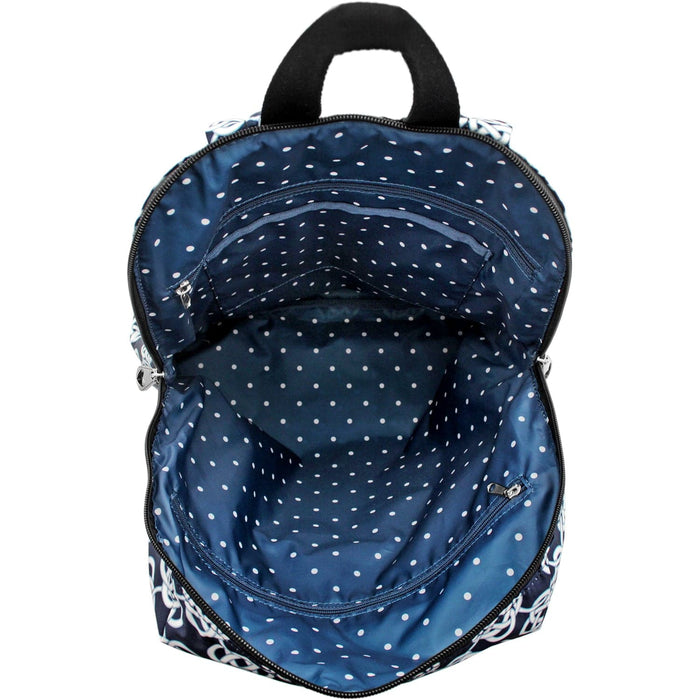 Close-up of Brighton backpack interior view showing navy polka dot lining with zippered pocket and top handle