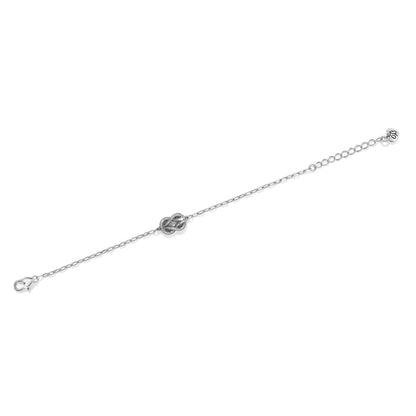 Brighton silver-plated bracelet with crystal-accented knot station, lobster clasp, and adjustable extender chain on a white background