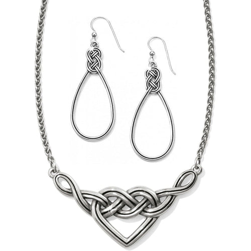 Brighton necklace with silver-tone Celtic knot heart pendant and matching teardrop knot earrings on a white background