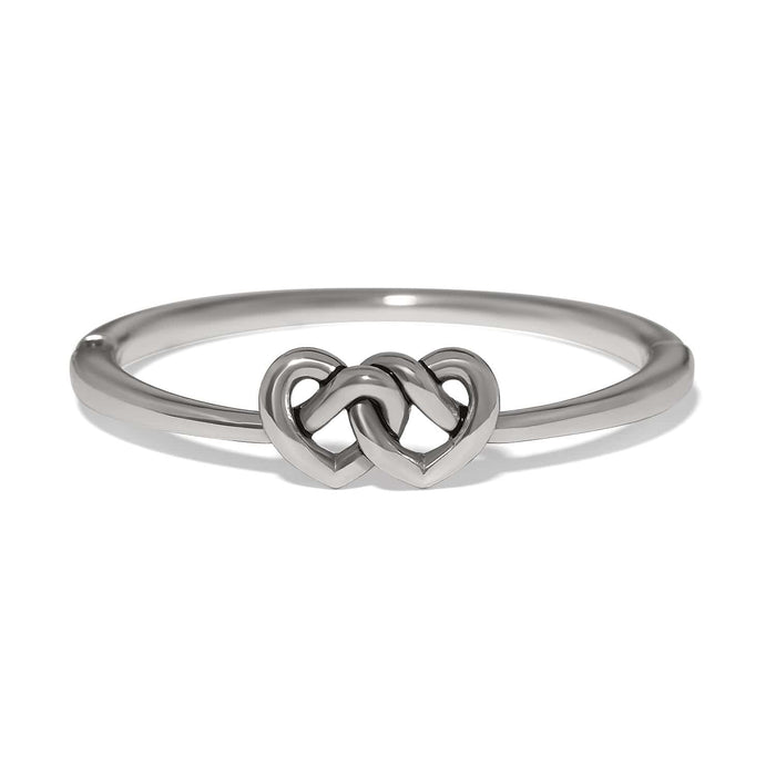 Brighton ring with silver-plated band featuring two interlocking heart motifs at the center on a white background