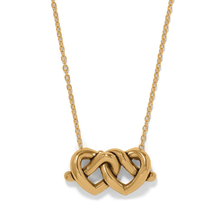 Brighton pendant necklace with two interlocking gold-plated hearts on a delicate chain on a white background