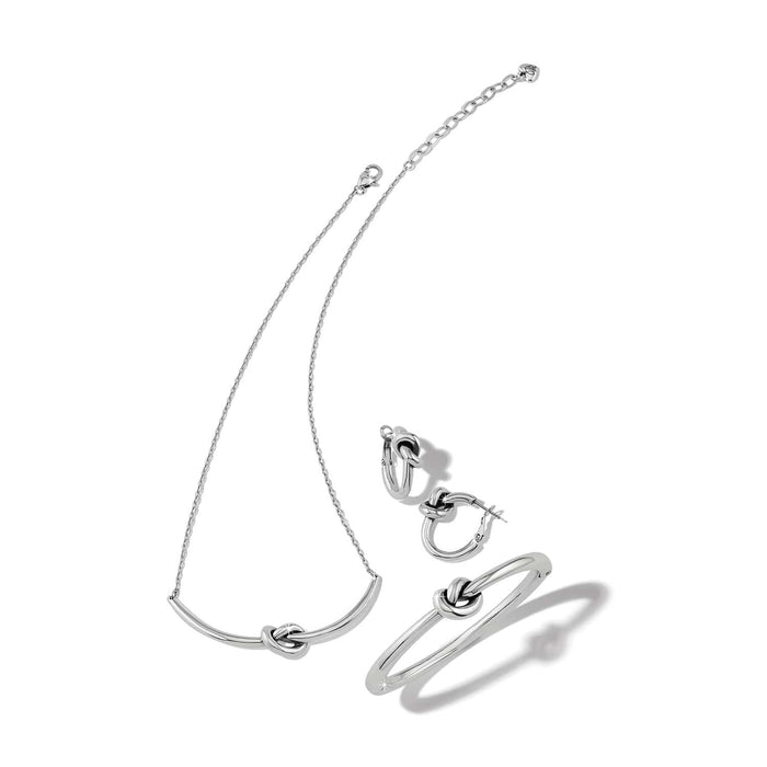 Brighton silver-plated jewelry set with knot-detail necklace, hoop earrings, and matching bangle bracelet on a white background