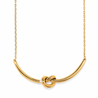 Brighton necklace with gold-plated curved bar pendant featuring a center knot detail and delicate chain on a white background