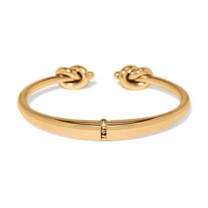 Brighton hinged cuff bracelet in gold-plated finish with double knot end caps on a white background