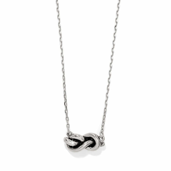 Brighton necklace with silver-tone infinity knot pendant on delicate chain on a white background
