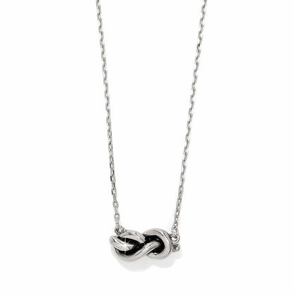 Brighton necklace with silver-tone infinity knot pendant on delicate chain on a white background